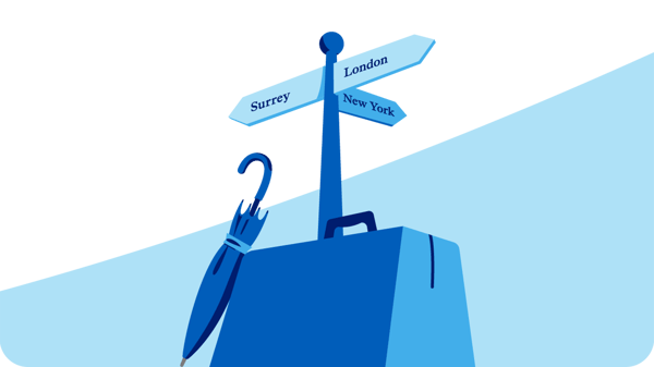 Illustration of a blue signpost with three directional signs labelled Surrey, London, and New York, placed on top of a blue suitcase with a closed umbrella leaning against it. The background features a light blue curved shape.