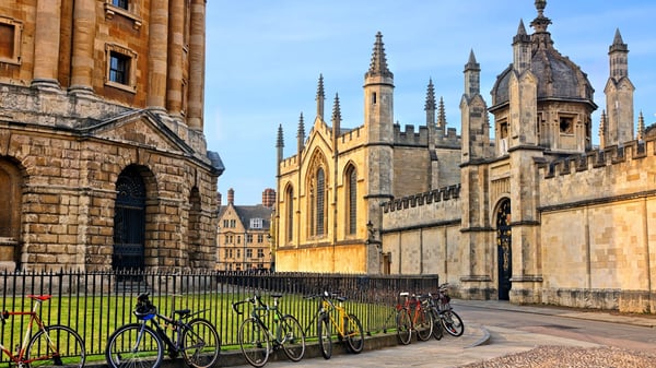 The Radcliffe Camera in Oxford, UK, at dusk with no people around, on a clear day with blue sky.