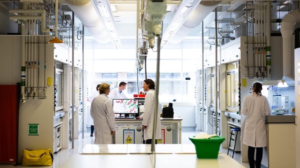 People gathering in a laboratory