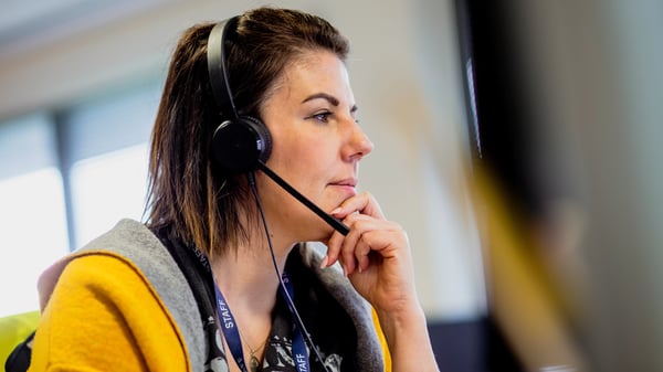 Female with a headset working in office