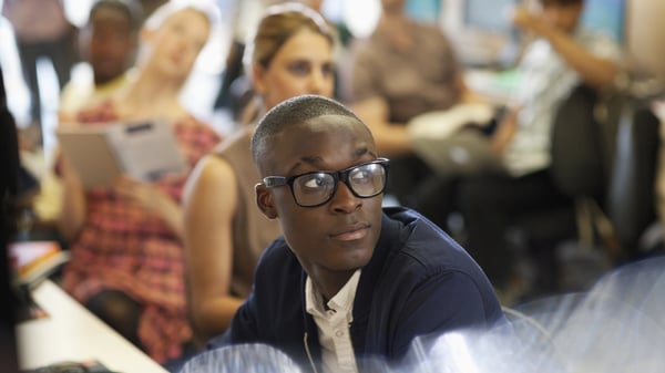 Young man listening in a class